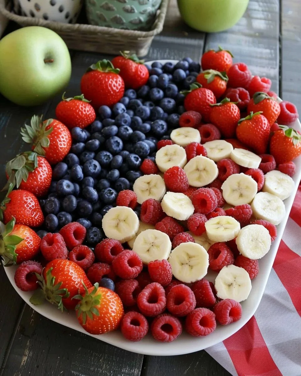4th of July fruit platter resembling the American flag with strawberries and blueberries.