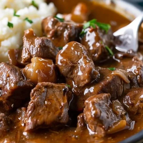 Delicious Crock Pot beef tips served with rich gravy for a comforting meal.