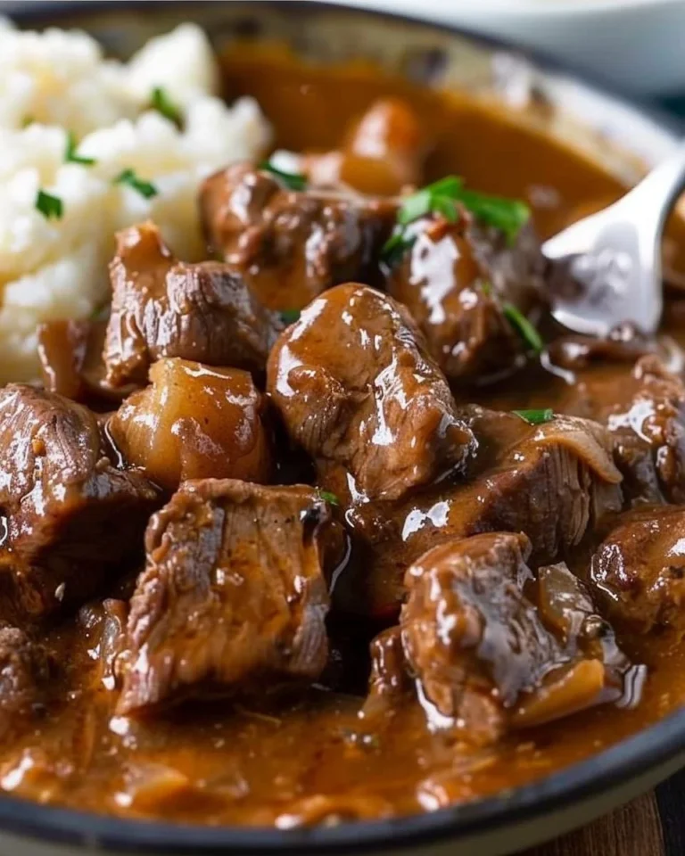 Delicious Crock Pot beef tips served with rich gravy for a comforting meal.