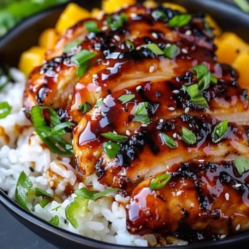Mango Glazed Chicken drizzled with a sweet and savory sauce for a delightful meal.