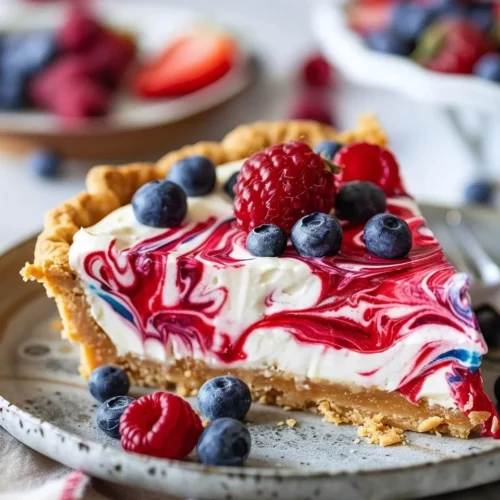 No-Bake 4th of July Swirl Pie decorated with red, white, and blue colors.
