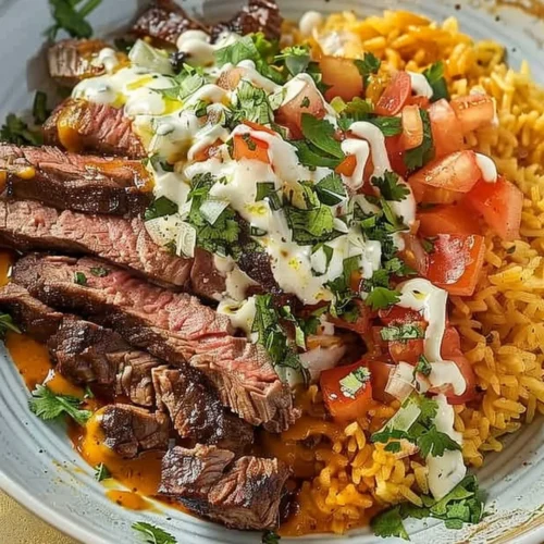 Delicious Steak Queso Rice Bowl topped with cheese sauce and fresh toppings