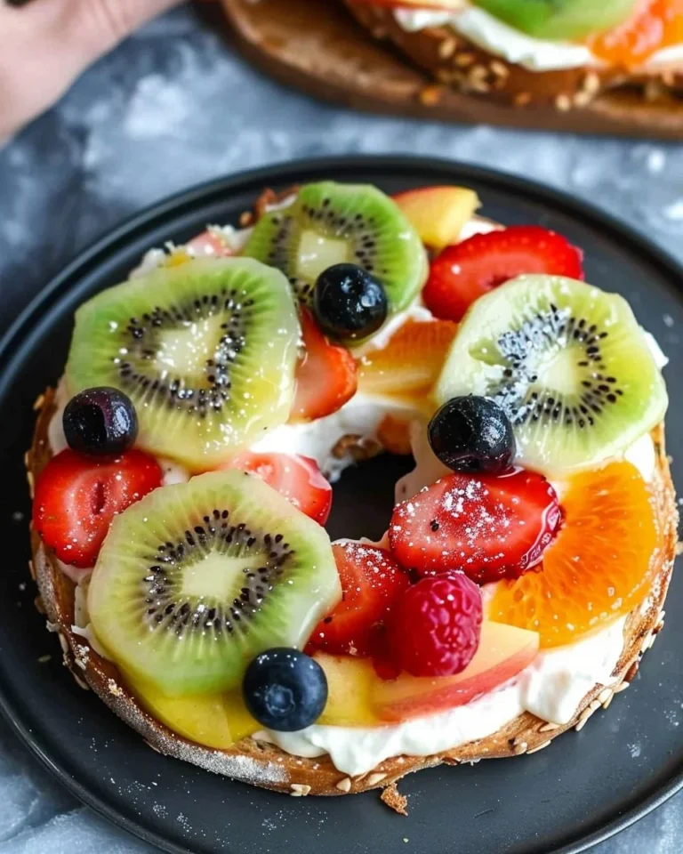Colorful bagel fruit pizzas topped with fresh fruits for a healthy breakfast.
