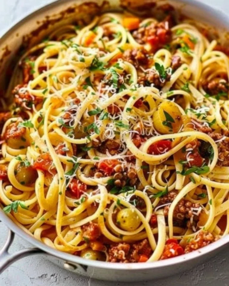 Delicious one-pot pasta dish garnished with fresh herbs and cheese