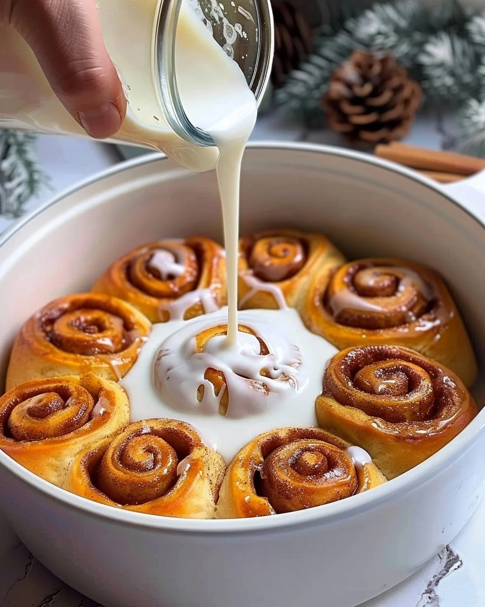 Delicious homemade pumpkin cinnamon rolls topped with cream cheese frosting